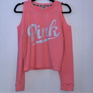 PINK cold shoulder crew neck top.